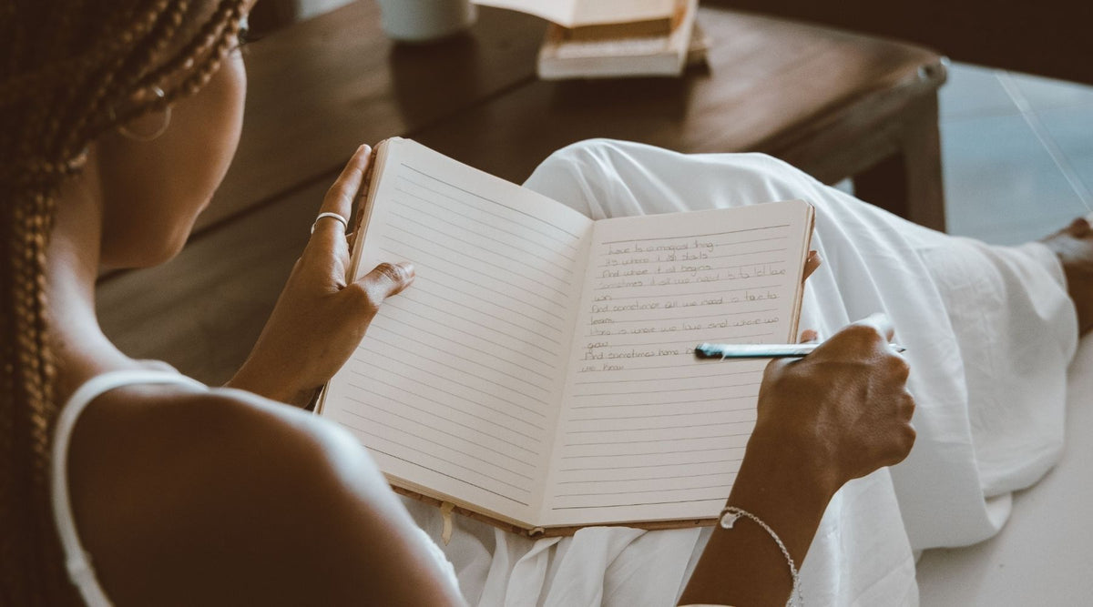 young woman journaling