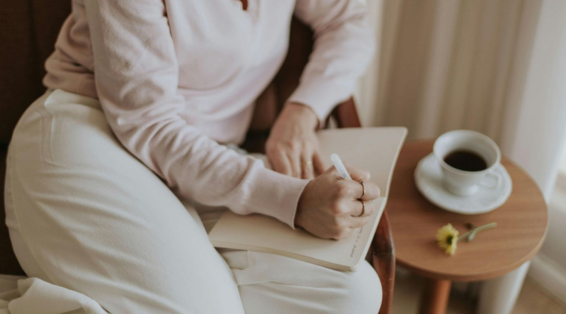 woman writing in journal