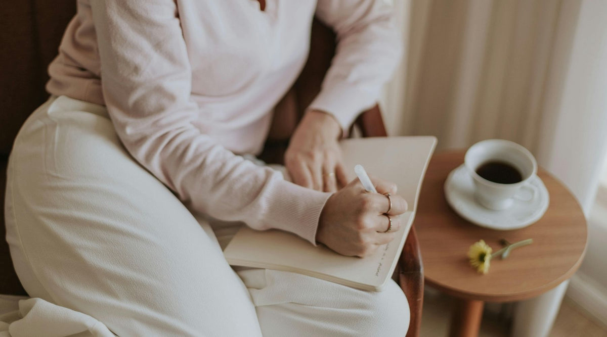 woman writing in journal