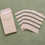 Set of 'Seeds of Calm' cards with a beige envelope on a green textured background