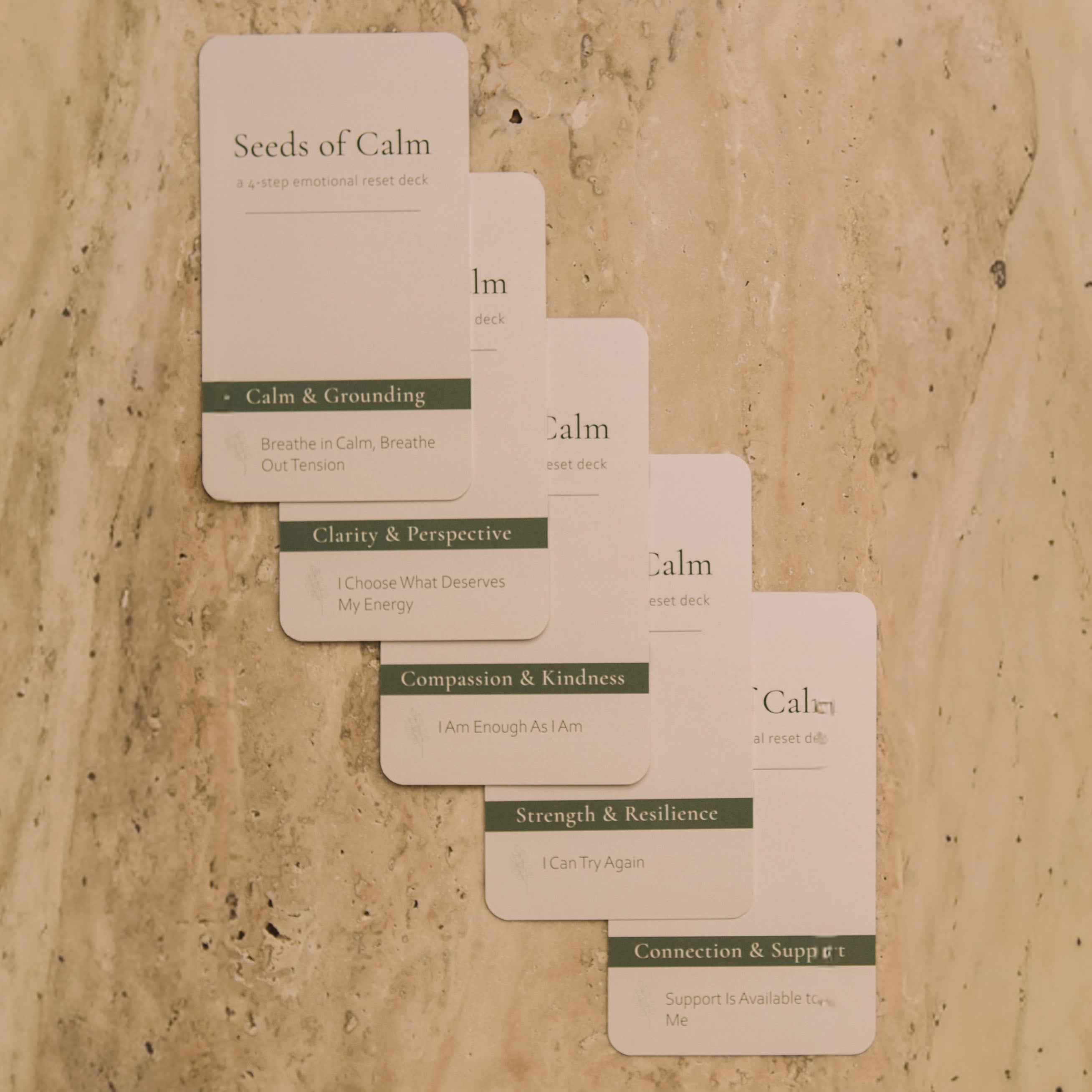 Set of 'Seeds of Calm' cards on a stone surface